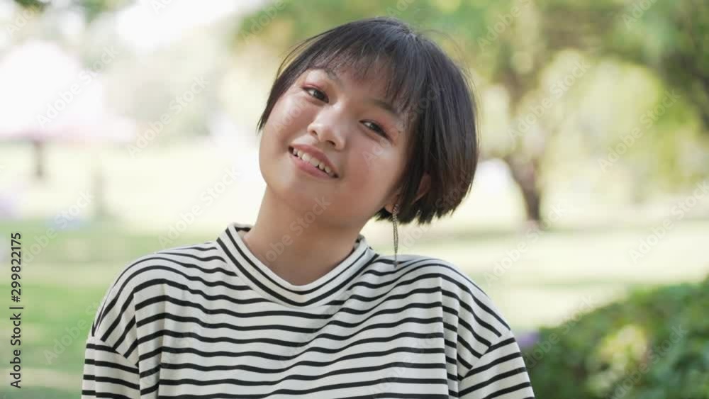 Happy Asian teenage in the garden Happy Asian teenage in the garden