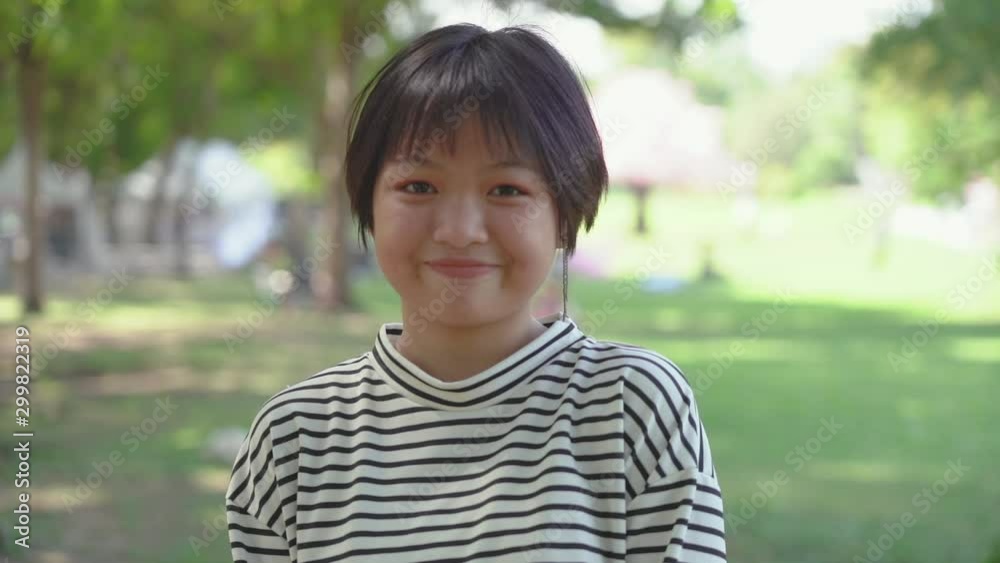 Happy Asian teenage in the garden Happy Asian teenage in the garden