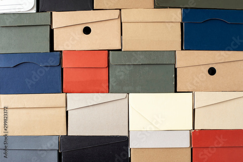 Quadro su tela Pile of evenly folded shoe boxes, can be used as a background or wallpaper