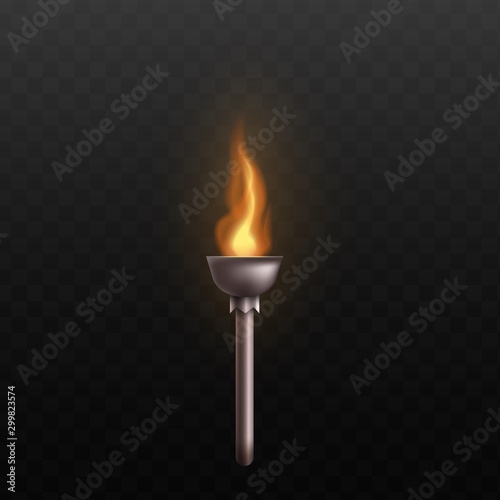 Medieval metal torch with burning fire isolated on black background