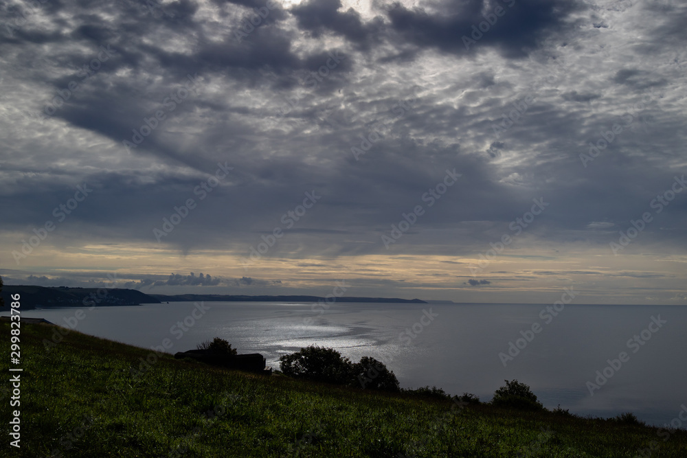 cloudy sunrise on the south Cornish coast inWhitsand bay