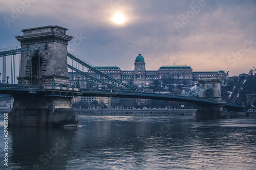 Bridges in Budapest over the Danube River and a building on the waterfront.