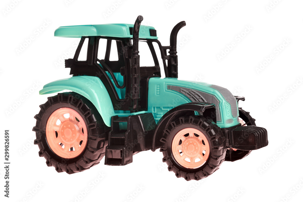 Fototapeta premium children's toy small green toy tractor isolated on white background