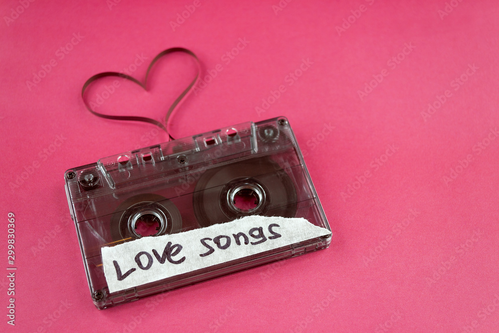 vintage old film music cassette on a trendy pink background with the  inscription love song, background music, music lovers, heart Stock Photo |  Adobe Stock