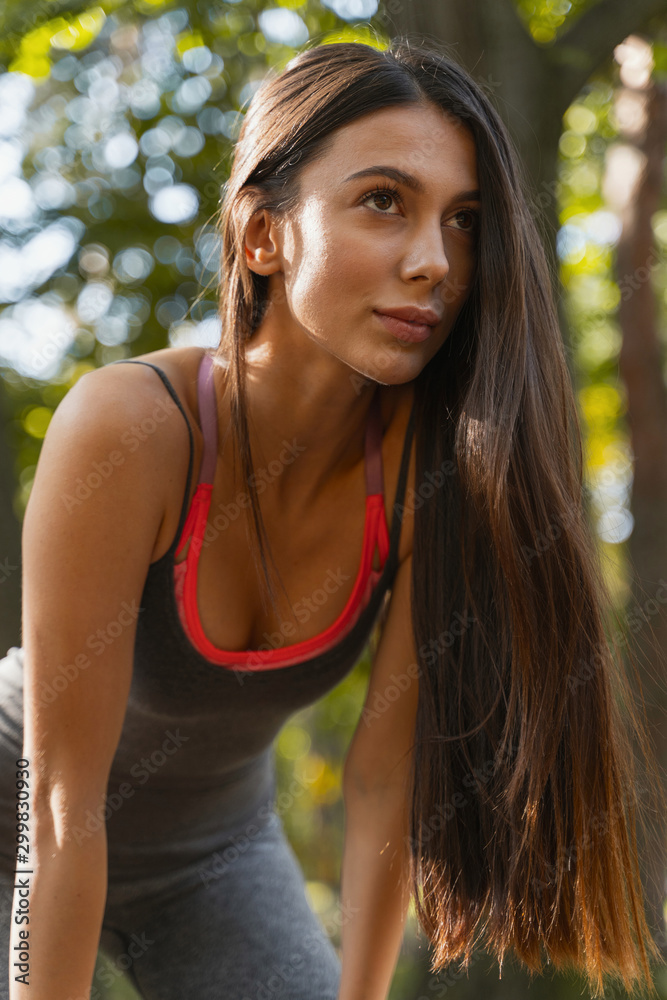 Pretty woman training intensively in the park Pretty woman training intensively in the park