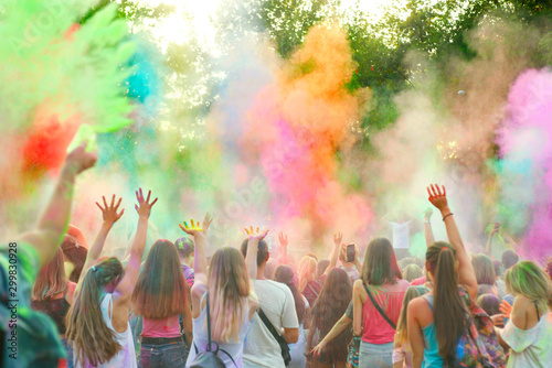 Holi festival of color. Holi colorful festival of colored paints of powders and dust. People covered with colored powder rejoice celebrate and dance photo