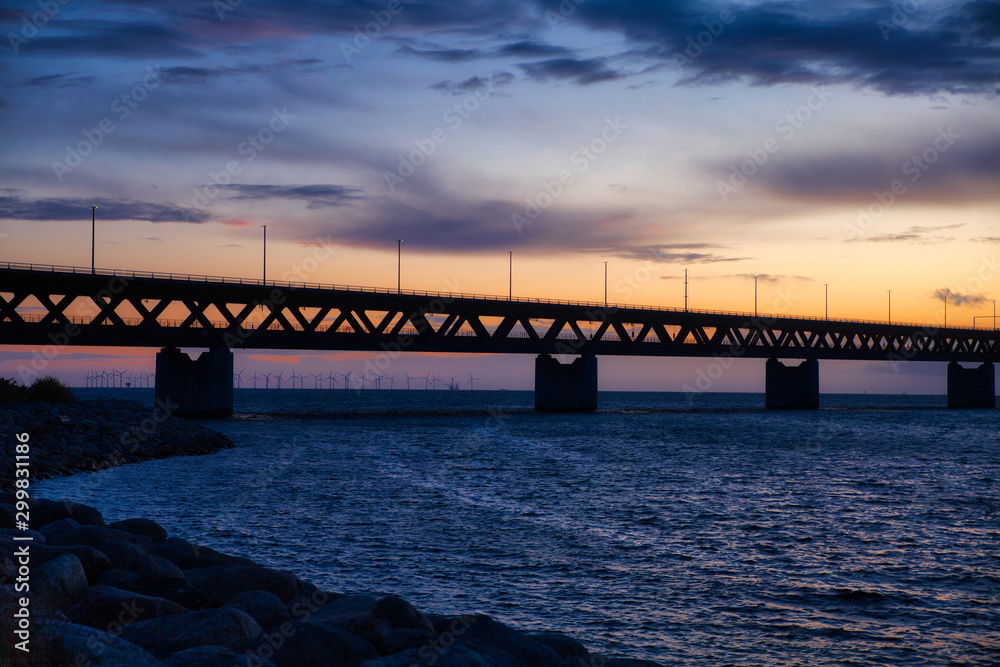 Öresund bridge with wind wheels and sundown Öresund bridge with wind wheels and sundown