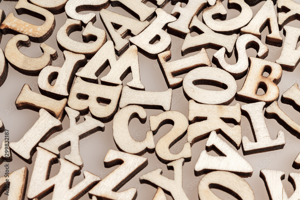 wooden letters of the English alphabet workpiece closeup macro wooden letters of the English alphabet workpiece closeup macro