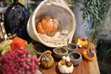 Decorative colorful pumpkins on wooden table.