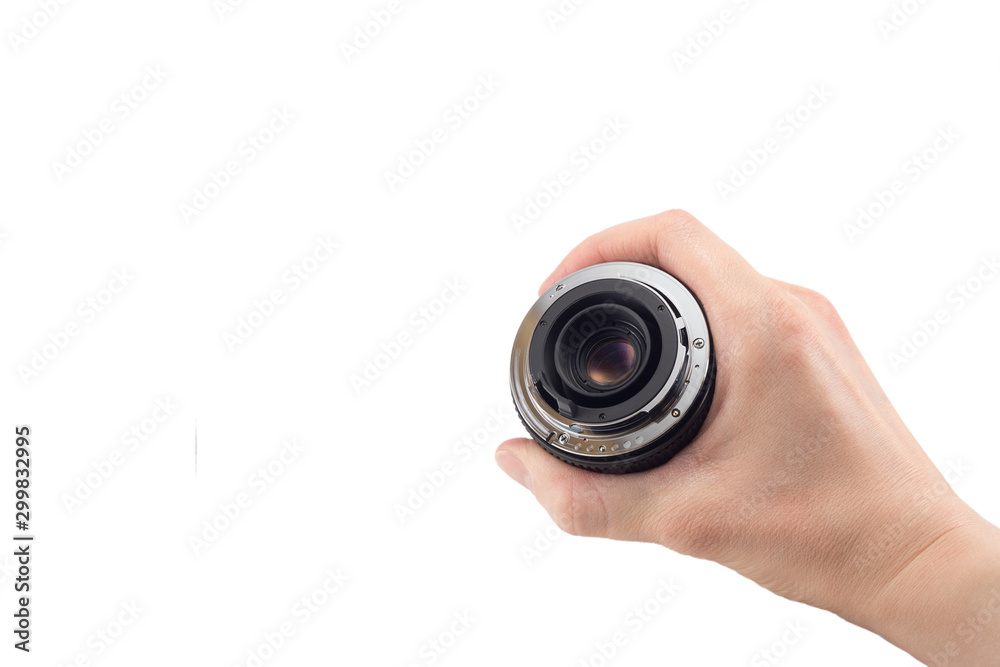 view of the back lens of the detachable camera lens in hand, the back of the lens, mount to the camera, isolated on white background view of the back lens of the detachable camera lens in hand, the back of the lens, mount to the camera, isolated on white background