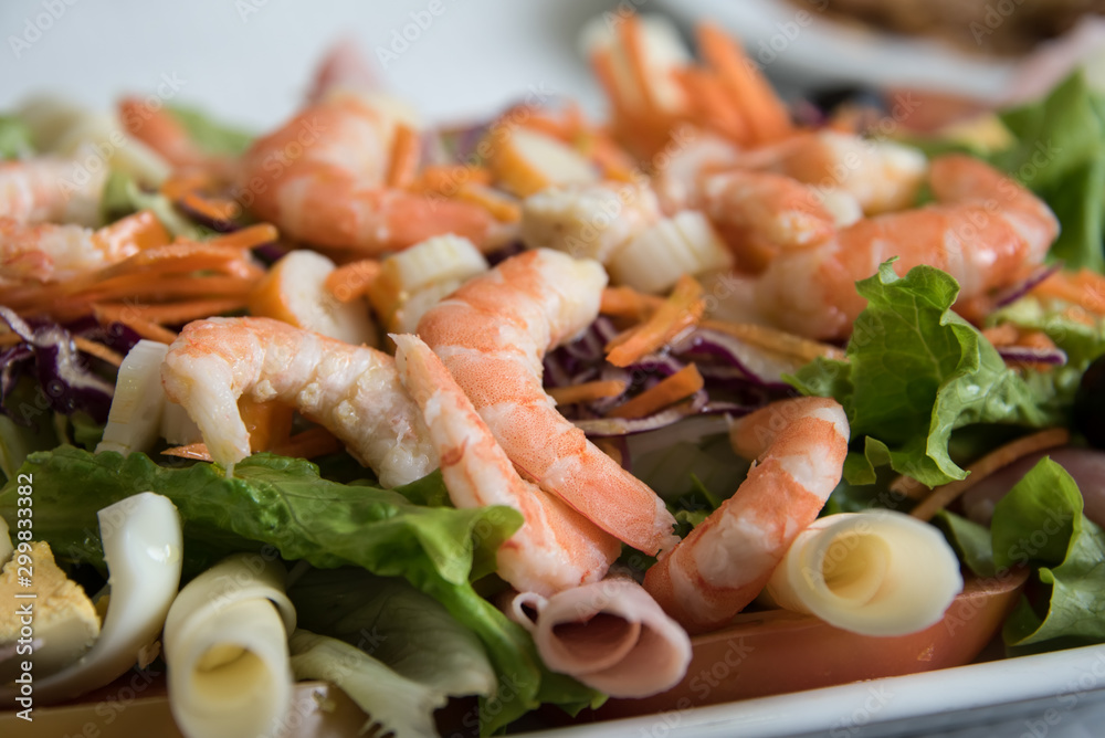 Fresh salad with shrimp, red cabbage and carrots . Fresh salad with shrimp, red cabbage and carrots .