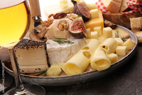 Different sorts of cheese. Cheese platter with different cheese and spice