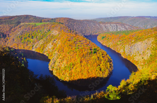 Beautiful Vyhlidka Maj, Lookout Maj, near Teletin, Czech Republic. Meander of the river Vltava surrounded by colorful autumn forest viewed from above. Tourist attraction in Czech landscape. Czechia © ppohudka
