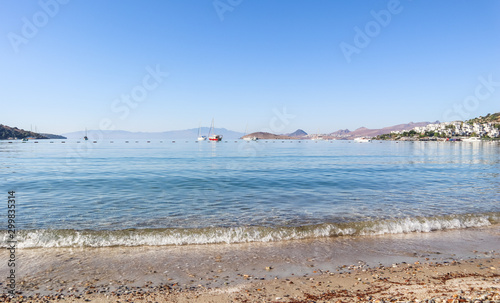 Beautiful calm blue bay with sand beach in Mediterranean. Holiday and relaxation on sea coast photo