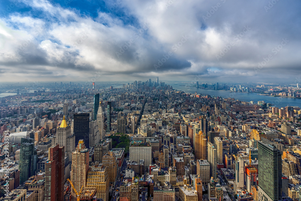 View Manhattan skyline with clouds from the top of Empire State building