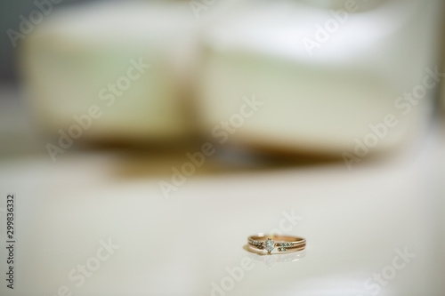 Gold wedding ring with women's shoes on the wedding day