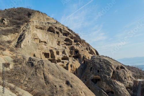 Ancient Cliff Dwellings of Guyaju Caves, about 80 kilometers northwest of Beijing, largest site of an ancient cliff residence in China, Yanqing County, Hebei Province, China photo