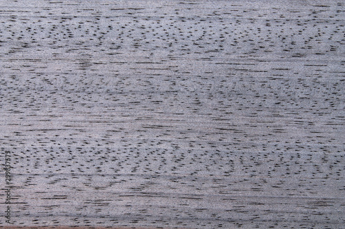 Gray wooden surface with horizontal lines of the structure.
