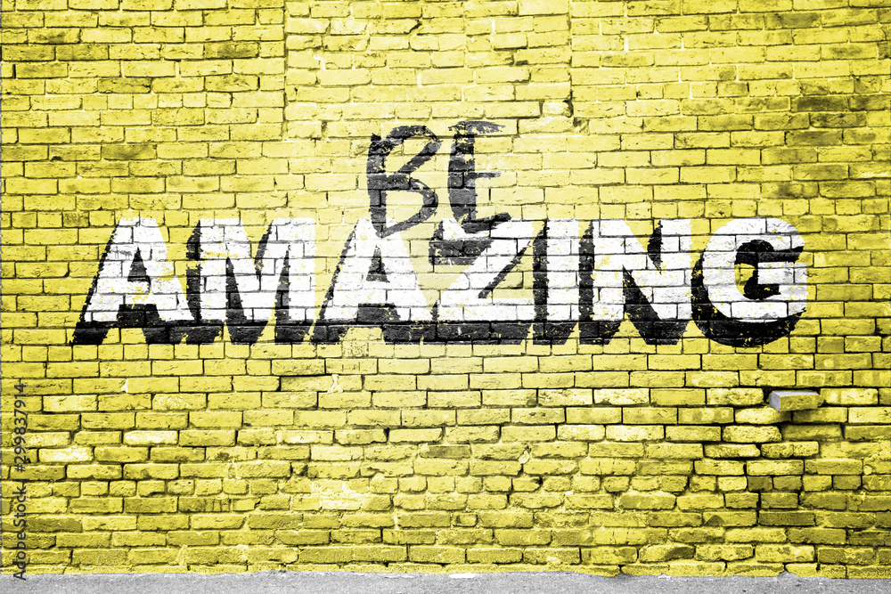 Fototapeta premium Be Amazing saying lettering Graffiti on Brick Wall