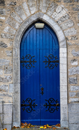 Blue wooden church door archway in rural Ireland © Gabriel Cassan