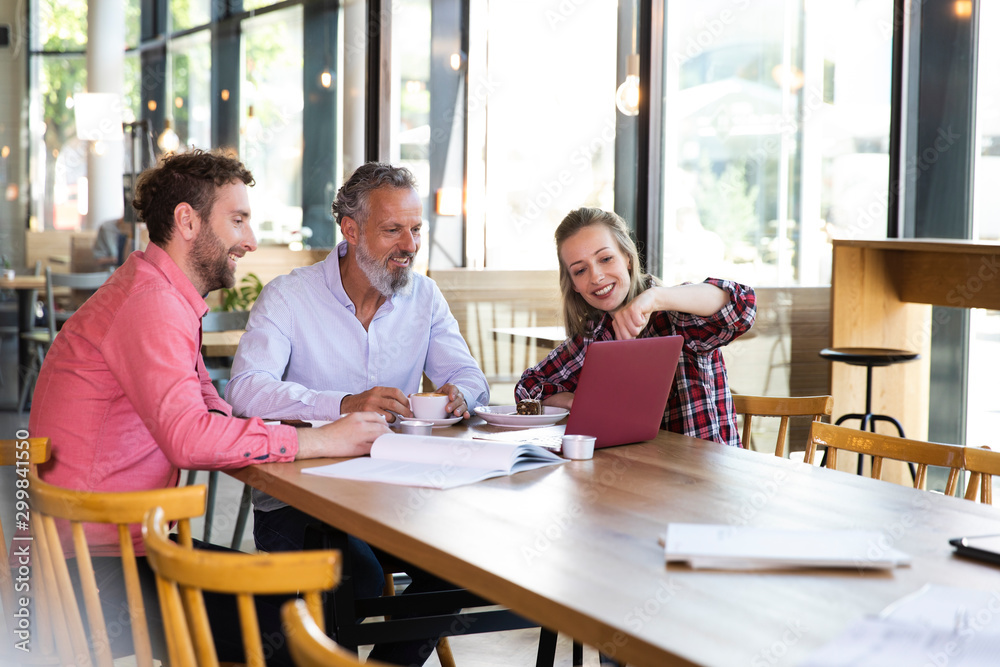 Casual business people having a meeting in a cafe Casual business people having a meeting in a cafe