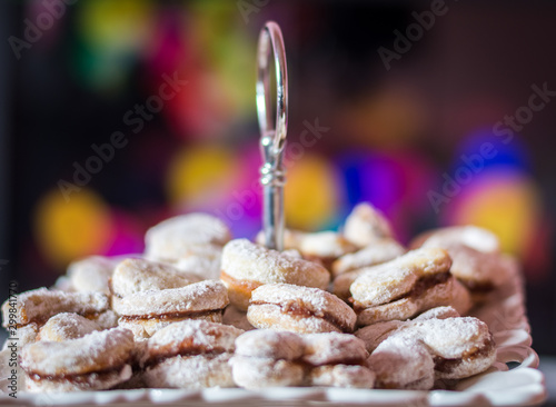 Vanilice (small Vanilla cookies) are bite-sized Serbian Vanilla cookies made as sandwich of two vanilla and walnut cookies held together with a dollop of jam, usually served around the Christmas photo