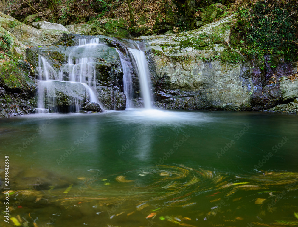 Beautiful Inunaki waterfalls, cascading from Mt. Inunaki in Izumisano, Osaka Prefecture, Japan.