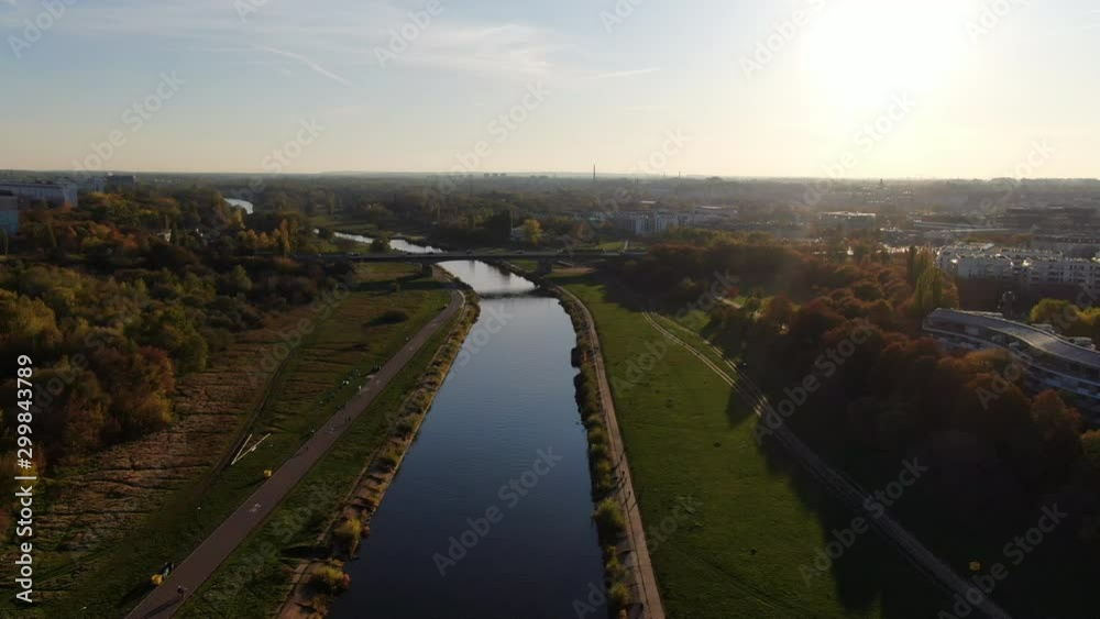 Aerial drone shot flying above Warta River and city Poznan Poland and in sunny day. Aerial drone shot flying above Warta River and city Poznan Poland and in sunny day.