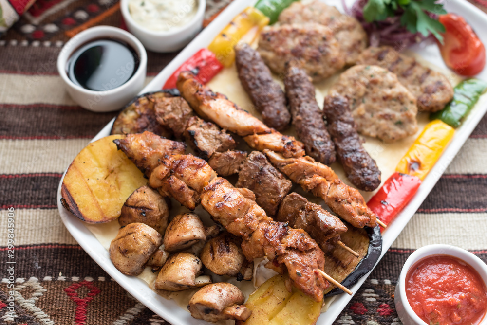 Middle Eastern Style Assorted Grilled Meat, Kebabs, Beef, Lamb, Chicken and Vegetables. Middle Eastern Style Assorted Grilled Meat, Kebabs, Beef, Lamb, Chicken and Vegetables.