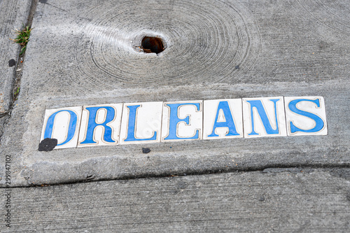 Photography Historic old town Orleans street sign on sidewalk pavement in New Orleans, Louis