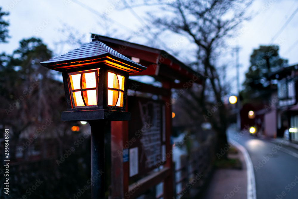 Takayama, Japan Small town in Gifu prefecture in Japan in traditional village at night with closeup of illuminated lantern lamp