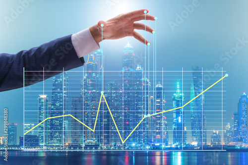 Tableau sur toile Businessman controlling the market with strings