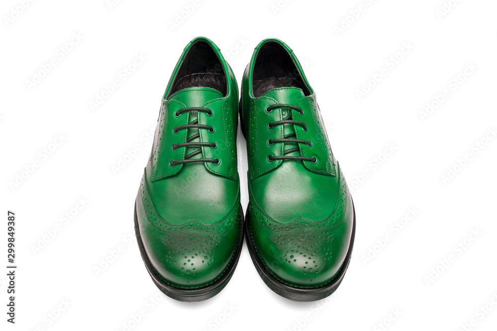 Pair of male green leather shoes on white background, isolated product, top view.