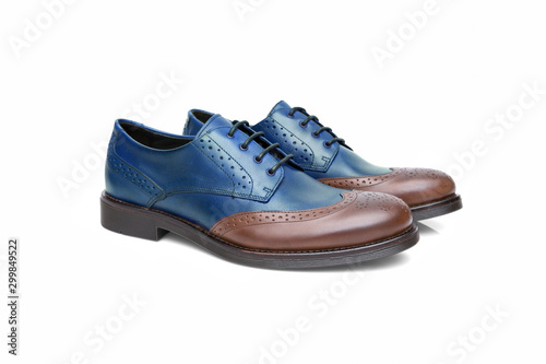 Pair of male cyan and black leather shoes on white background, isolated product, top view.