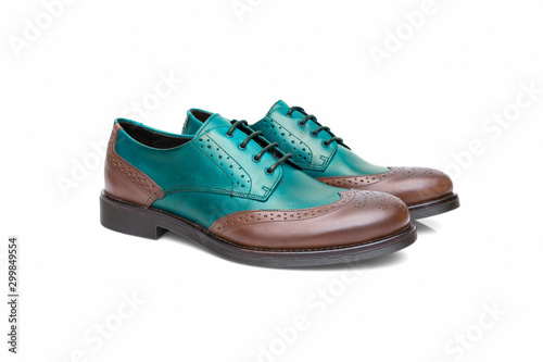 Pair of brown and cyan shoes on white background, isolated product.