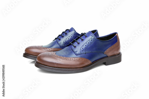 Pair of brown and blue leather shoes on white background, isolated product, top view.
