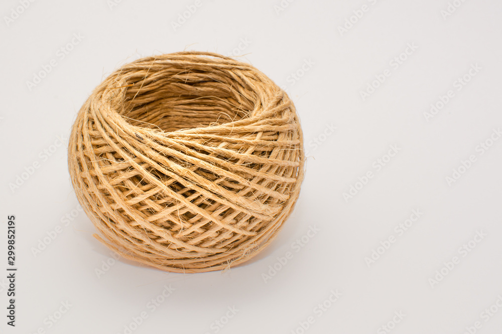 Ball of string, natural twine isolated on a white background. Ball of string, natural twine isolated on a white background.