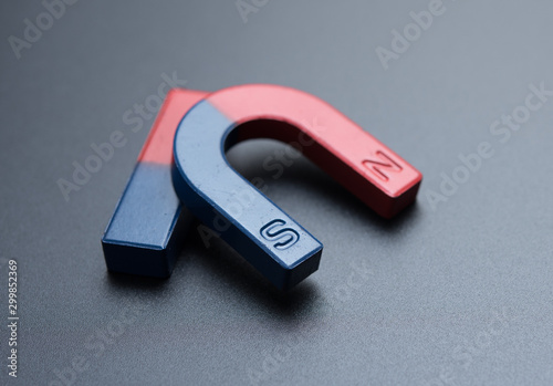 U shape steel magnet and bar magnet on gray background.
