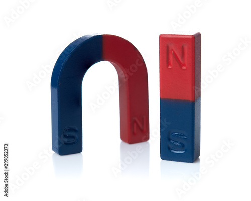 Konstfotografi U shape steel magnet and bar magnet over white background.