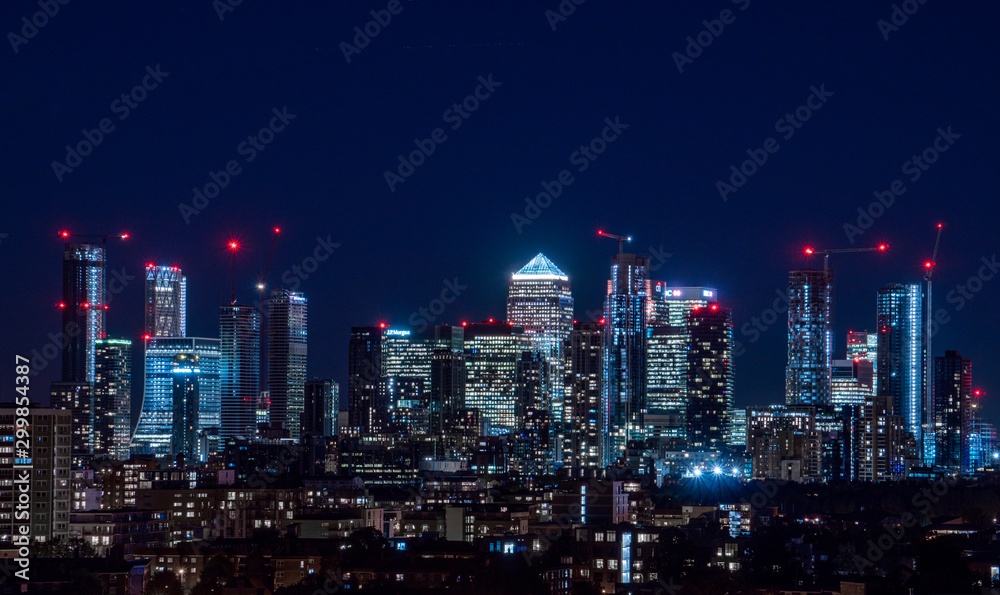 London / United Kingdom - October 4th 2019: Night panorama of the Canary Wharf financial district taken from Blackheath
