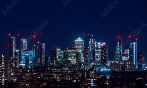 London / United Kingdom - October 4th 2019: Night panorama of the Canary Wharf financial district taken from Blackheath © Alex Danila