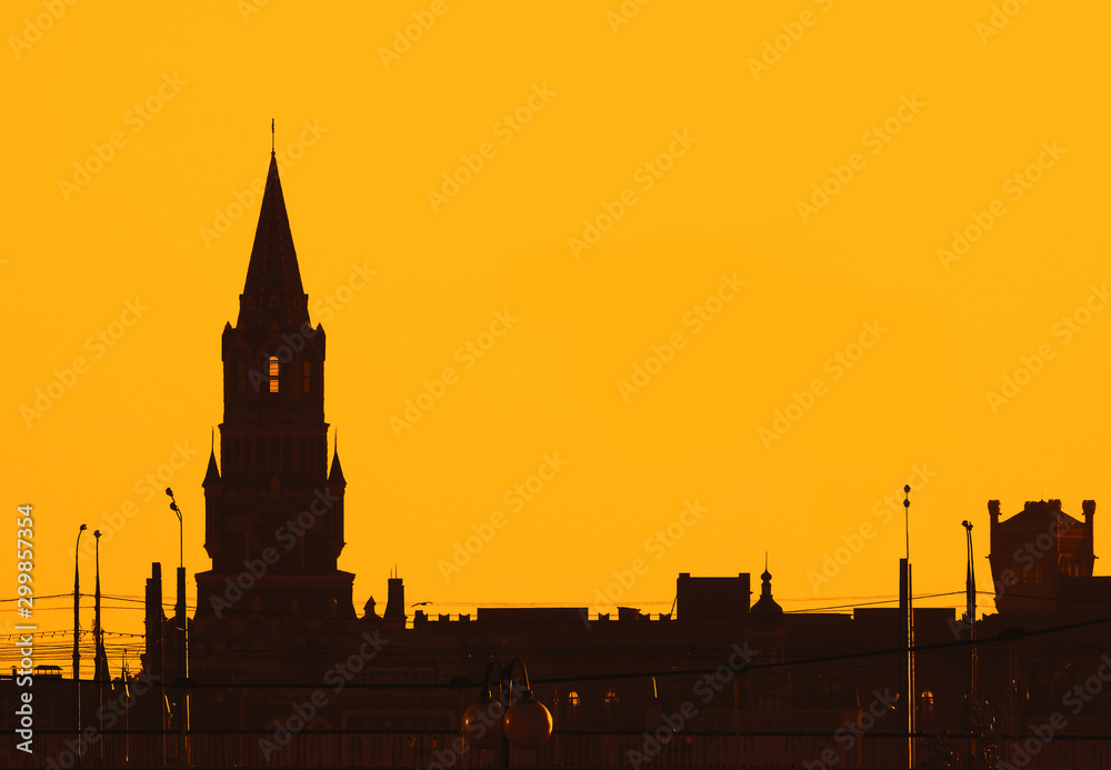 Silhouettes of city tower at the yellow sky with place for text. Yoshkar-Ola city, Mari El, Russian Federation