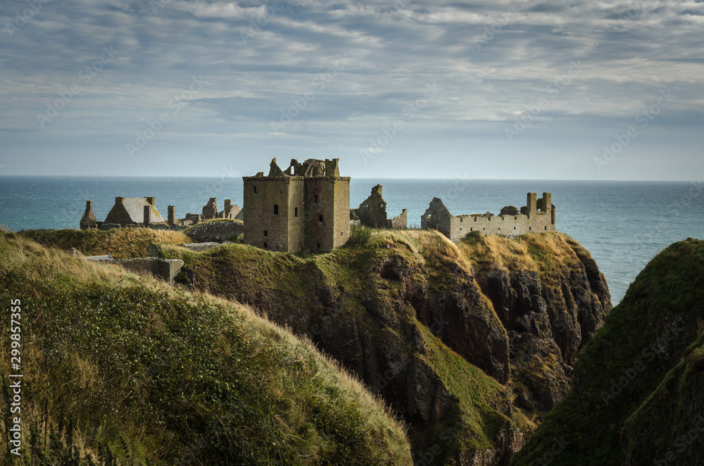 View of the Dunnottar Castle on the top of the hill in a cloudy day, Stonehaven, Scotland, United Kingdom