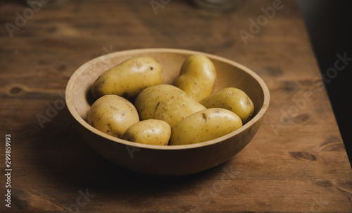 Raw organic potatoes in a bowl  part of a healthy diet