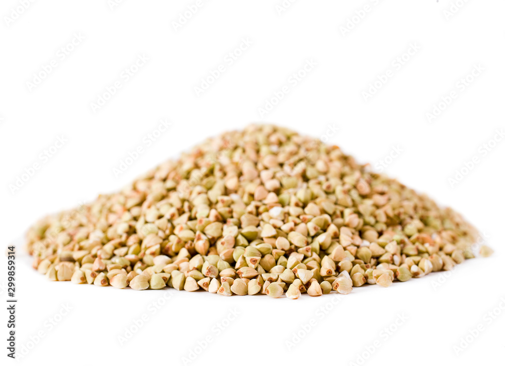 Heap of green buckwheat groats isolated on a white background.