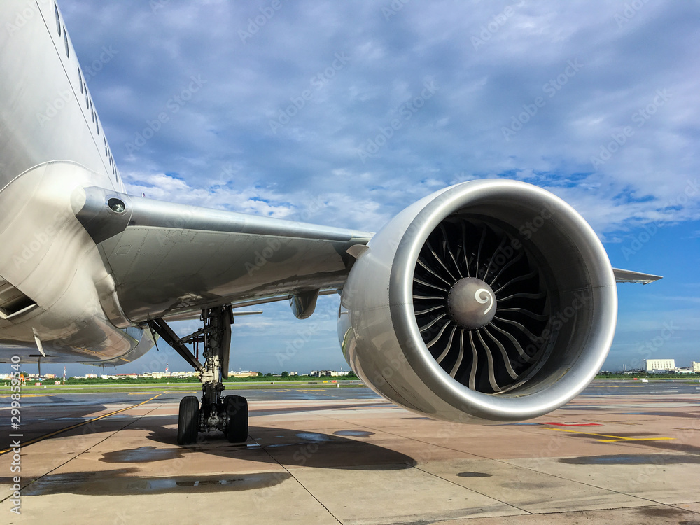 Fototapeta premium Jet engine of aircraft at airport with blue sky background,aviation industrial and transportation.