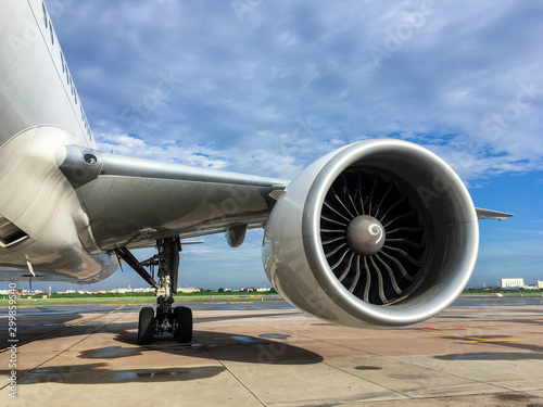 Jet engine of aircraft at airport with blue sky background,aviation industrial and transportation.