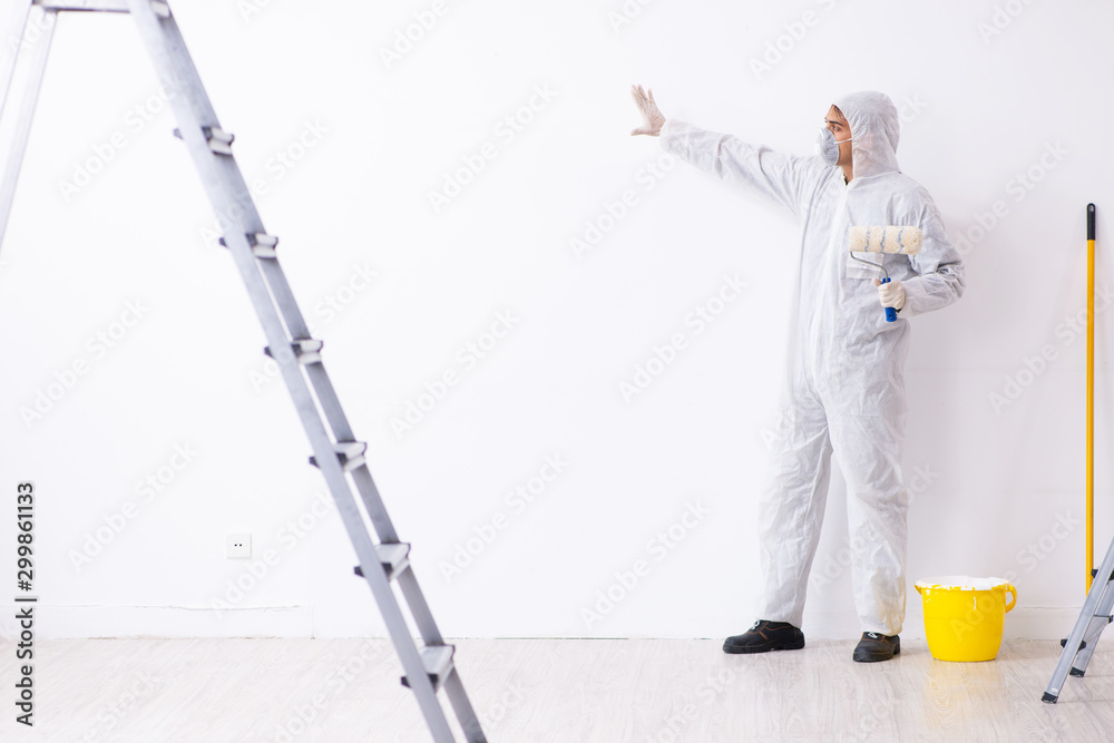 Painter working at construction site Painter working at construction site