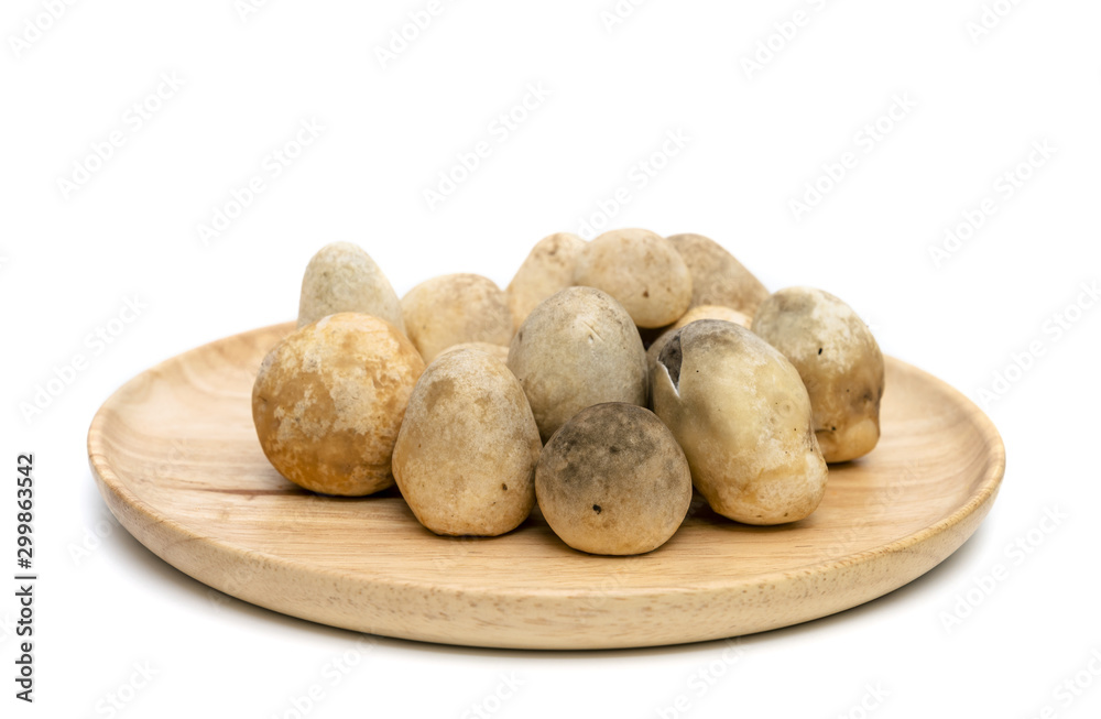 Straw mushroom on wooden dish,isolated on white background