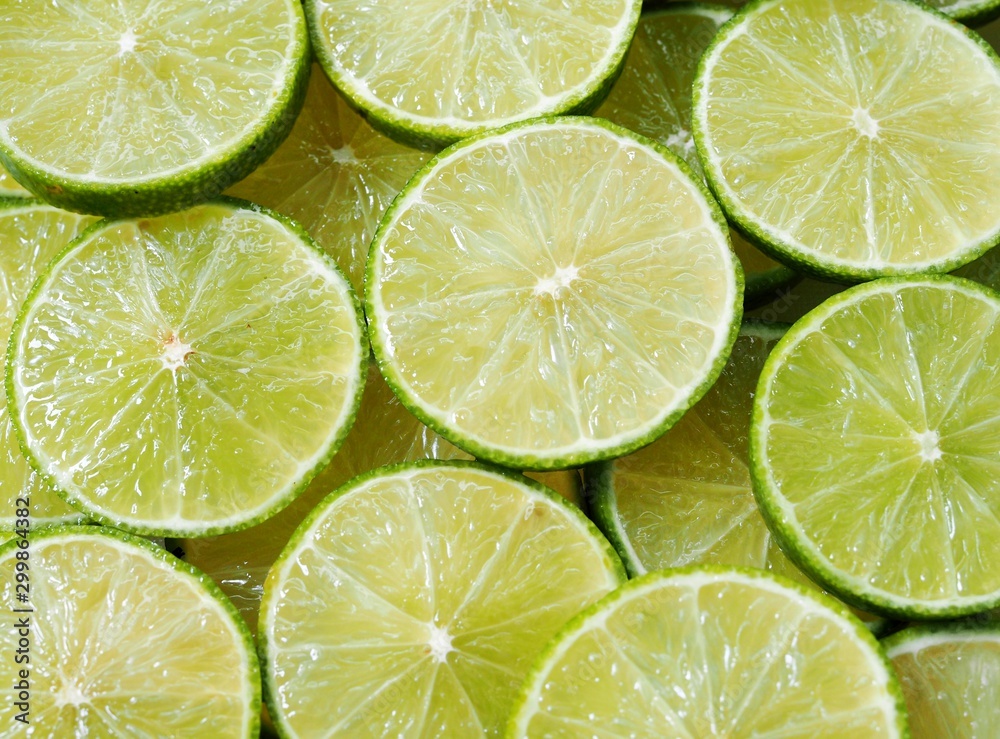Top view of green lemon background, juicy slice of lime wallpaper. Top view of green lemon background, juicy slice of lime wallpaper.